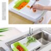 Multifunctional drainable retractable cutting board